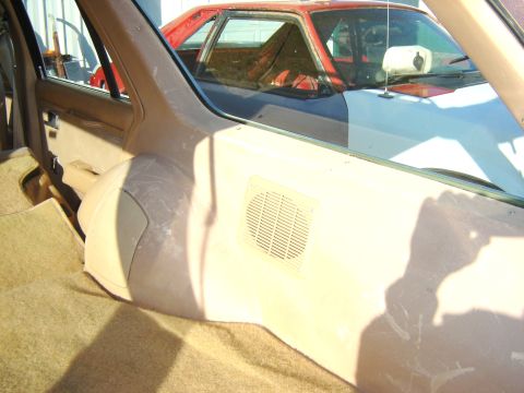 1984 Ford LTD - Interior view of a car's passenger side, with another vehicle visible through the window.