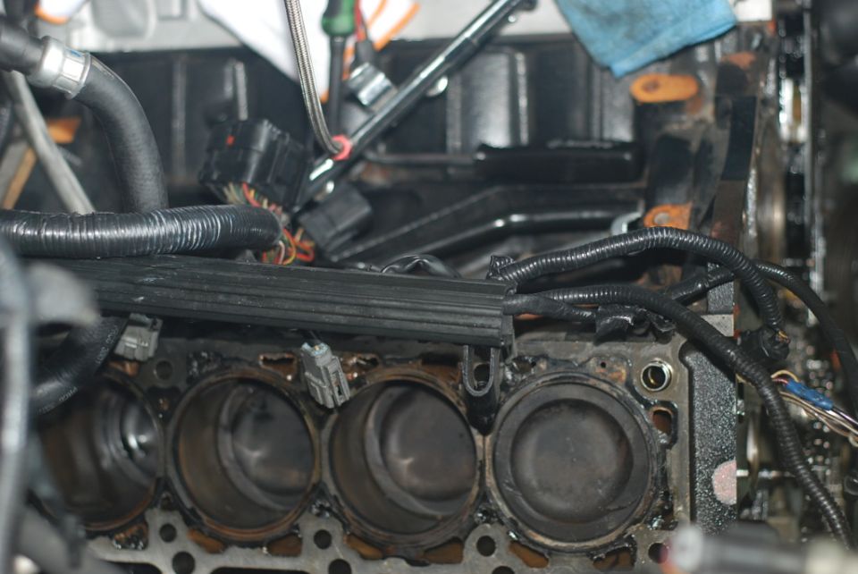 Engine block showing cylinders and associated wiring harnesses