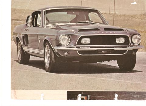 1968 Ford Mustang - 1968 Ford Mustang Shelby GT500 shown in a 3/4 front view on a paved surface.