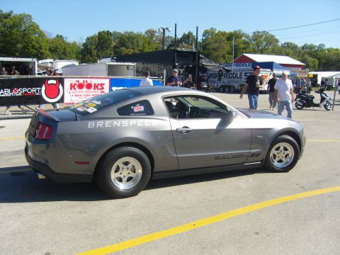 2007 Ford Mustang - A gray 2007 Ford Mustang, modified by Saleen and Brenspeed, sits on racing slicks at an event.