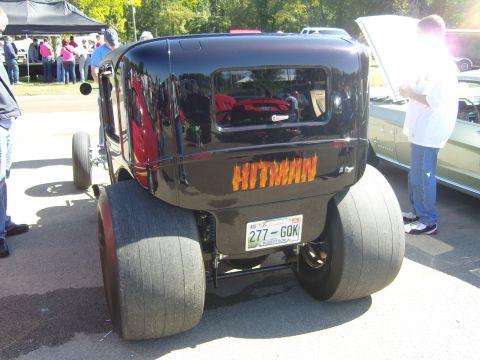 2007 Ford Mustang - This custom hot rod features oversized rear tires and a "HITMAN" graphic on its trunk, with a license plate from August 2007.
