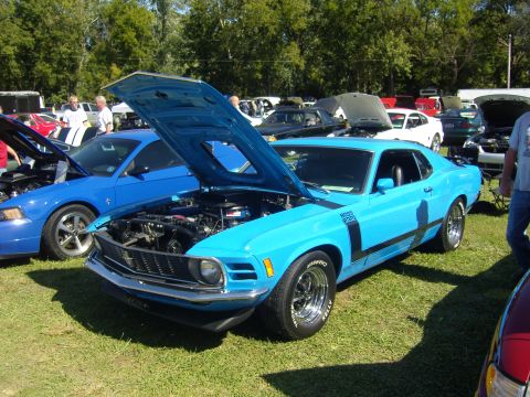 2007 Ford Mustang - A bright blue 1970 Ford Mustang Boss 302 is displayed with its hood open at an outdoor car show.