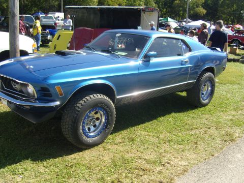 2007 Ford Mustang - This lifted 1969 Ford Mustang features aggressive off-road tires and custom wheels, giving it a unique stance.