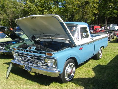 2007 Ford Mustang - Classic Ford F-series pickup truck on display with its hood open.