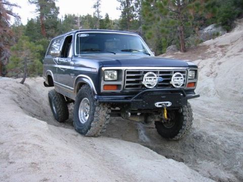 1985 Ford Bronco - This modified Ford Bronco navigates a rocky off-road path.