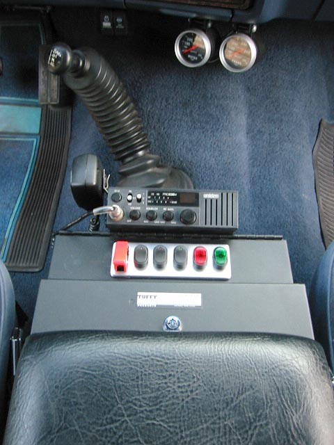 1985 Ford Bronco - Interior view of a 1985 Ford Bronco, highlighting the center console with communication and control equipment.