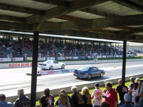 2007 Ford Mustang - A blue 1990 Ford Mustang competes in a drag race at Beech Bend Raceway, with spectators in the stands.