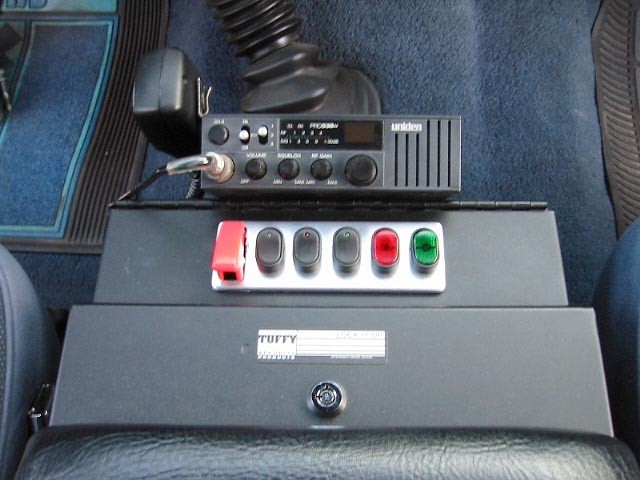 Center console with Uniden CB radio, accessory switch panel and locking Tuffy box