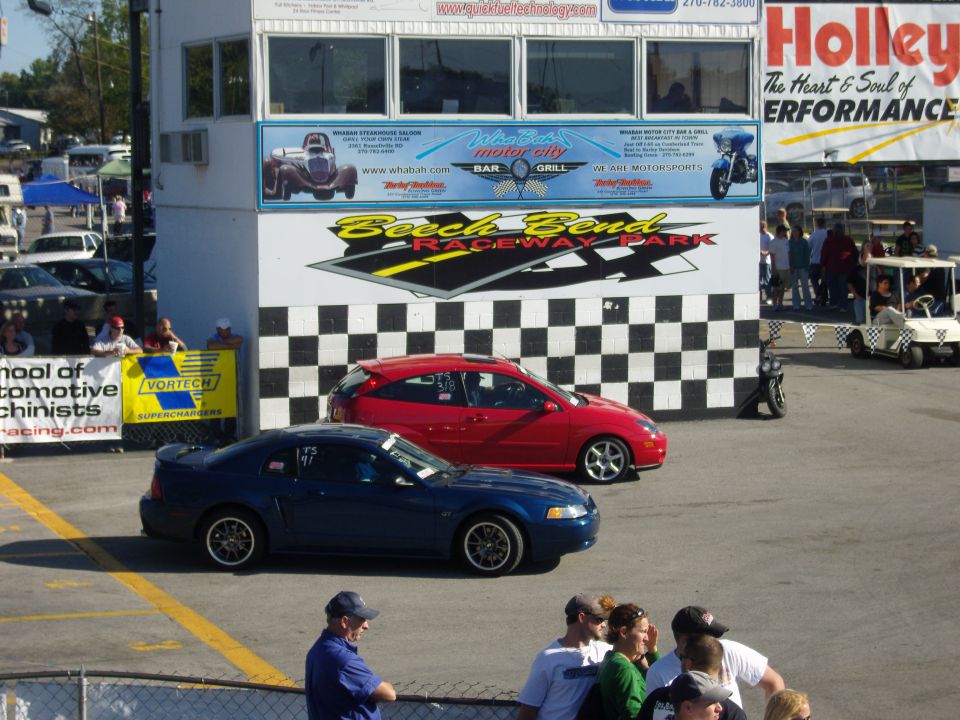 Blue Ford Mustang and red Ford Focus at Beech Bend Raceway Park