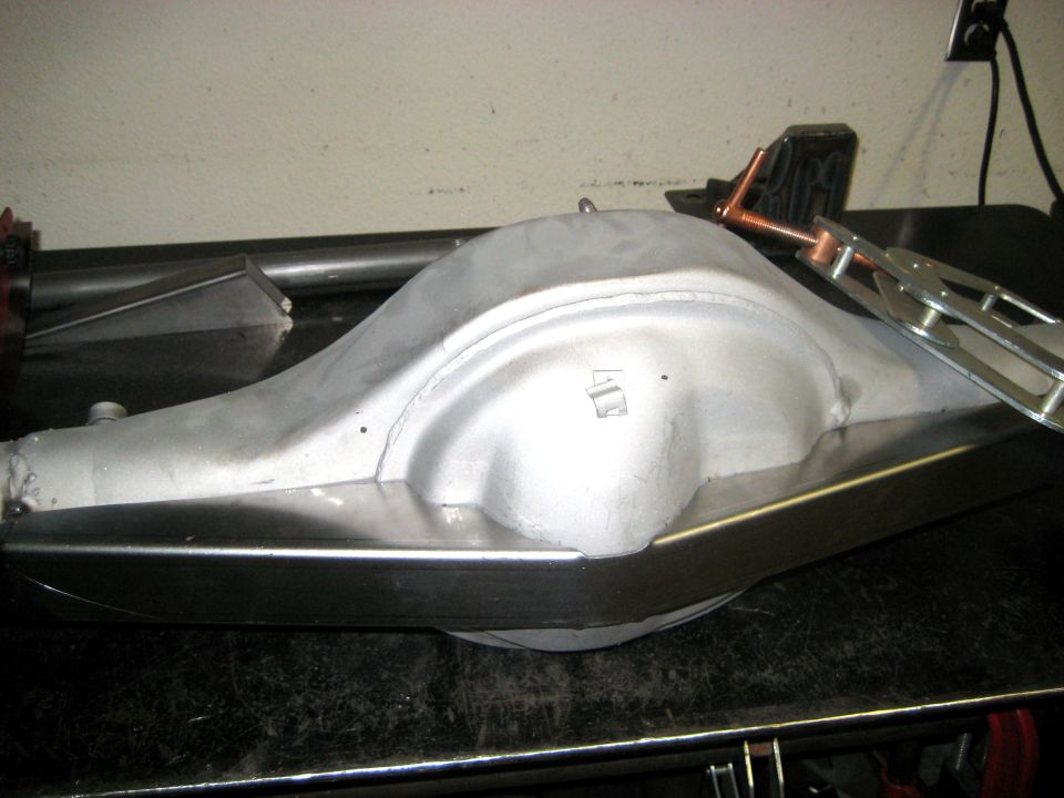 Rear axle differential housing with metal bracing attached