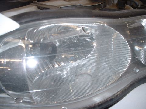2000 Ford Crown Victoria - Strobe hole in headlight.
