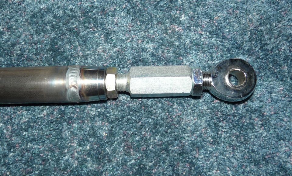 Adjustable tie rod end with hex adjustment sleeve and threaded stud