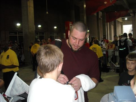 1979 Ford F-150 - Event staff and attendees are visible in the background of this interaction.