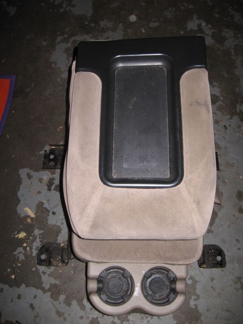 2001 Chevrolet Silverado 1500 - This is a vehicle's center console, a storage area and dual cup holders.