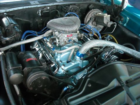 1979 Ford F-150 - Close-up of a V8 engine bay chrome components and aftermarket parts.