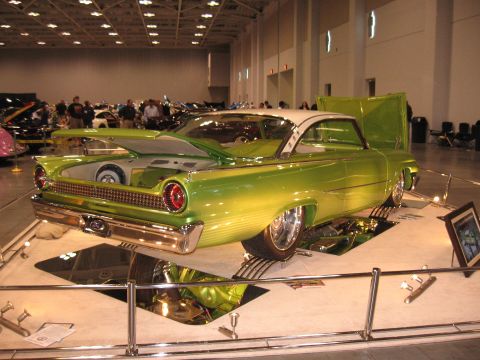1968 Shelby GT500 - A custom 1959 Ford Fairlane 500 Skyliner with a two-tone paint job is displayed at a car show.