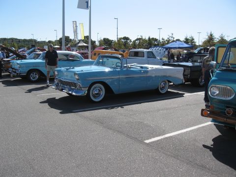 1968 Shelby GT500 - A light blue and white convertible is parked at a car show with other vehicles visible.