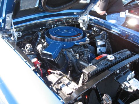 1968 Shelby GT500 - The engine bay of a 1968 Shelby GT500 shows its V8 engine with a prominent blue air cleaner assembly.