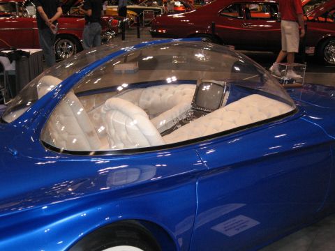 1968 Shelby GT500 - A custom blue car with a unique bubble canopy and plush interior, a small television screen.