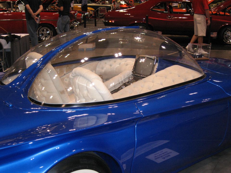 Blue custom car interior with bubble canopy and vintage TV