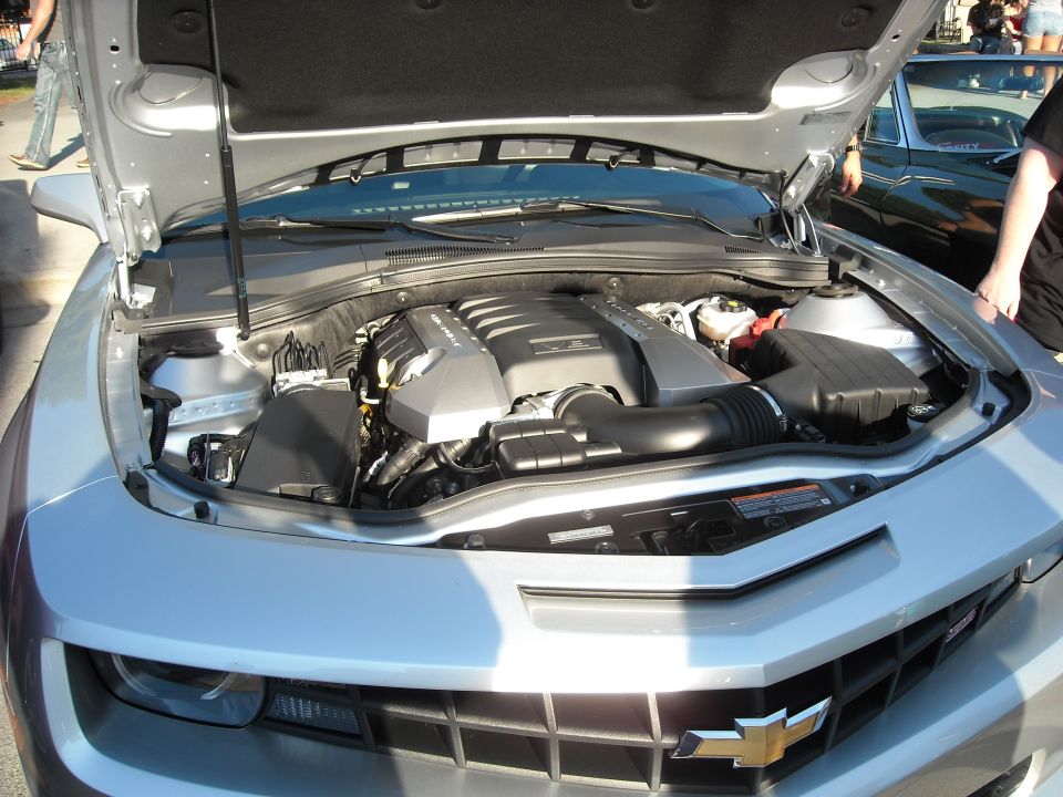 Silver Chevrolet Camaro engine bay with hood open