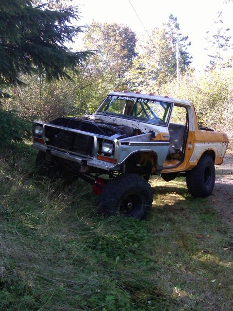 1978 Ford Bronco - This modified 1978 Ford Bronco features off-road tires and suspension, with its hood open.