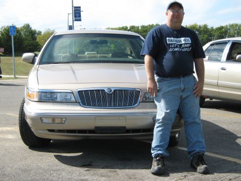 2000 Mercury Grand Marquis - Man poses with a 2000 Mercury Grand Marquis at a car meet.