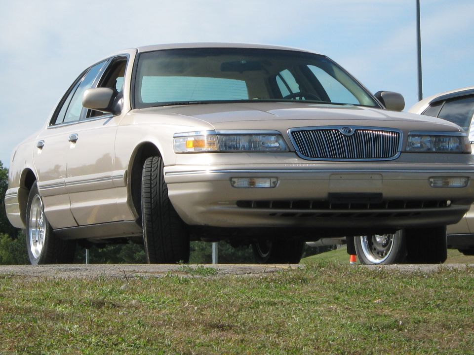 Tan 2000 Mercury Grand Marquis, front view, chrome grille, slight angle