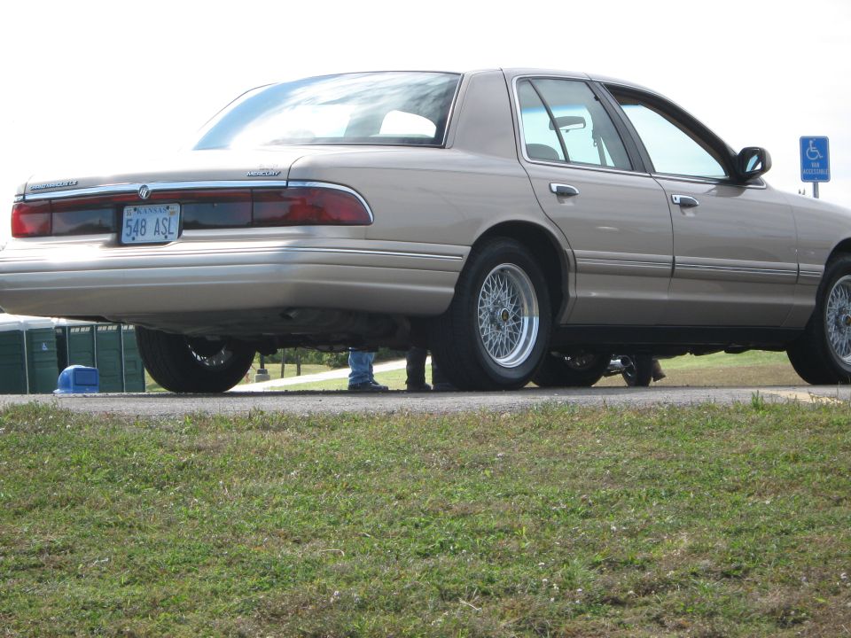 Tan 2000 Mercury Grand Marquis rear view with wire wheels