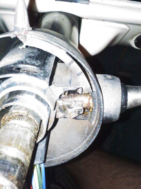 1977 Ford F-100 - This image shows a close-up view of the steering column's internal components and wiring harness.