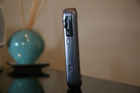 1992 Ford Taurus - A silver cell phone is shown in profile, displaying its side buttons and ports.