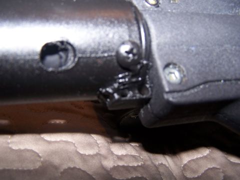 1986 Ford Bronco - Detail of a vehicle part, possibly from a steering column, with visible hardware.