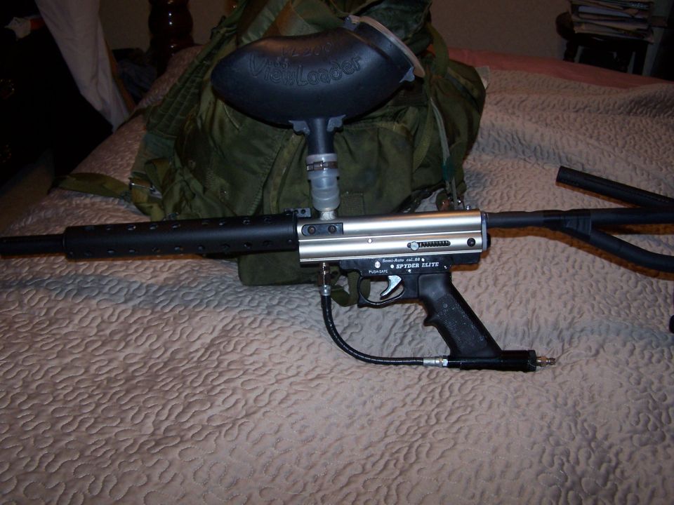 Silver paintball gun with black barrel and hopper