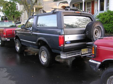 1993 Ford Bronco - This 1993 Ford Bronco is seen from the rear, equipped with a spare tire and a roof rack.