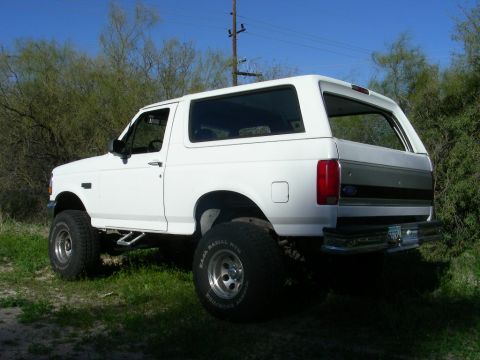 1996 Ford Bronco - This 1996 Ford Bronco is shown from the rear 3/4 angle, lifted with large tires.