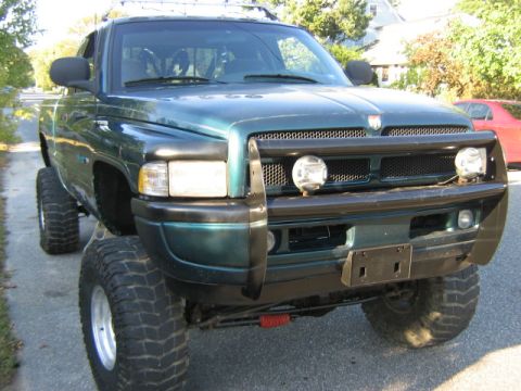 1998 Dodge 1500 - This lifted 1998 Dodge 1500 pickup truck features a prominent bull bar and aggressive off-road tires.