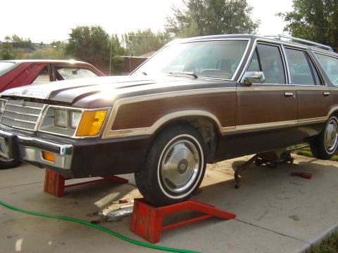 1984 Ford LTD - 1984 Ford LTD station wagon with wood paneling, shown on jack stands.