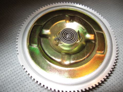 1968 Shelby GT500 - This is a close-up view of a fan clutch assembly, showing its internal spring mechanism and toothed outer ring.