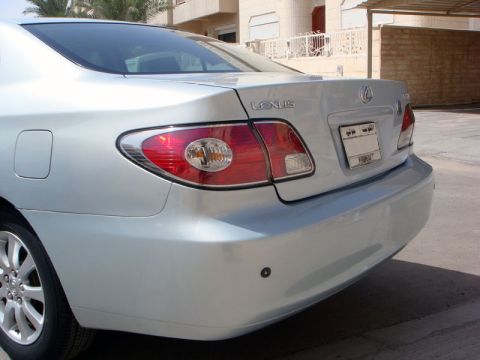 2002 Lexus ES 300 - The rear of a silver Lexus sedan, identified as a 2002 model based on its body style and taillight design.