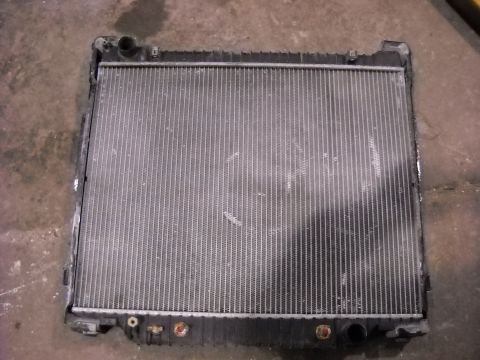 1986 Ford C-350 (Centurion Conversions) - A vehicle radiator is shown, likely removed for repair or replacement.