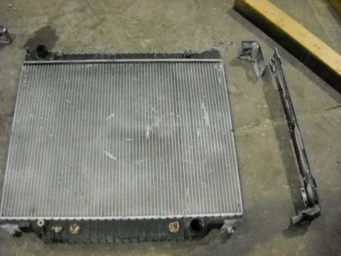 1986 Ford C-350 (Centurion Conversions) - Radiator and mounting bracket removed for repair.