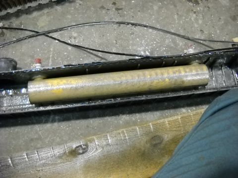 1986 Ford C-350 (Centurion Conversions) - Close-up view of a radiator core showing a yellow tube within the assembly.