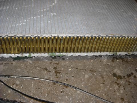 1986 Ford C-350 (Centurion Conversions) - A radiator part is shown in detail, likely for repair or replacement.