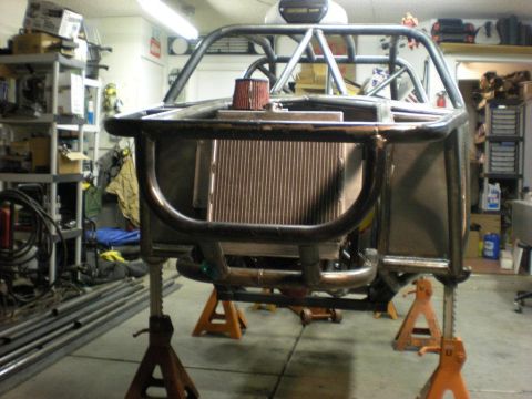 Suzuki Samurai - Custom buggy frame under construction, showing roll cage and radiator assembly.