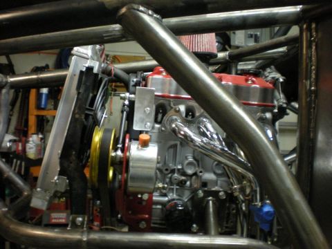 Suzuki Samurai - Custom engine setup with a roll cage and radiator in view.
