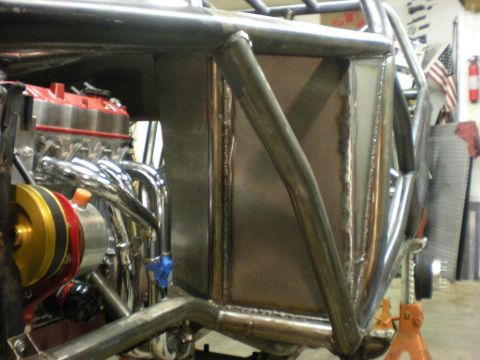 Suzuki Samurai - A custom-built vehicle chassis is shown with its engine and exhaust components visible.