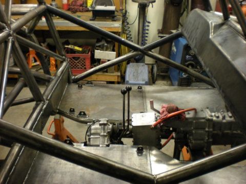 Suzuki Samurai - Custom tube chassis interior shows the transmission and transfer case assembly, likely for a project vehicle.