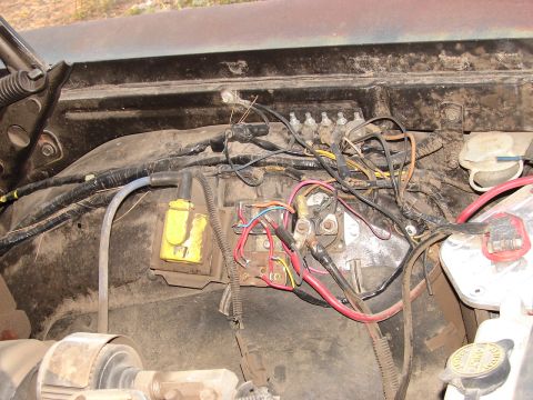 1973 Ford Ranchero - Engine bay wiring with ignition coil and fuse block visible.