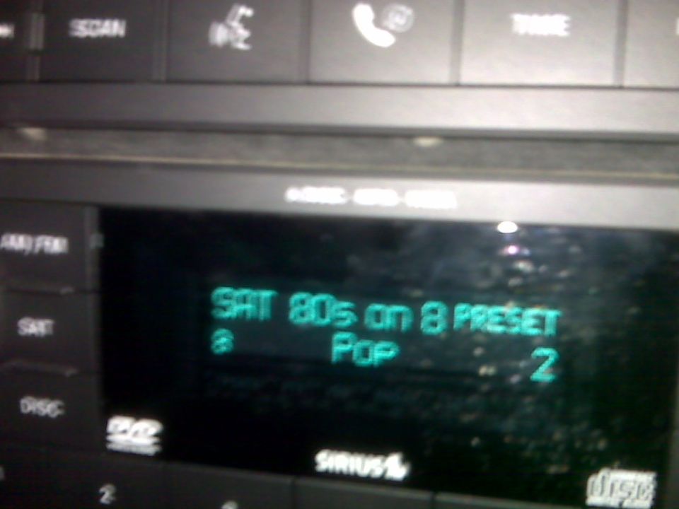 Car stereo shows SAT 80s on 8 PRESET, Pop, 2. Sirius logo visible