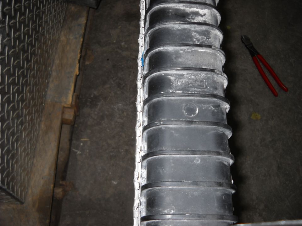 Radiator with visible text and red wire cutters nearby